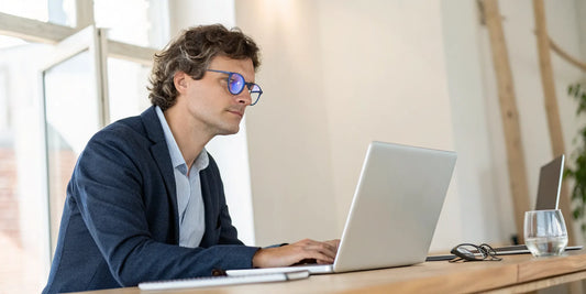 Man wearing glasses for computer screen eye protection.