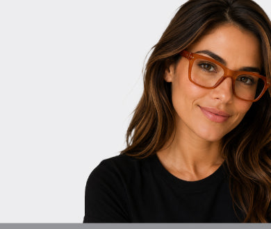 Man and woman smiling wearing reading glasses